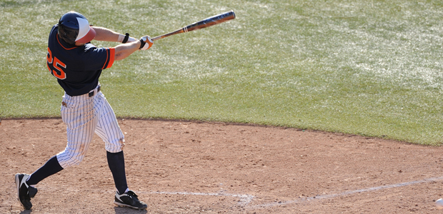 Baseball player hitting ball